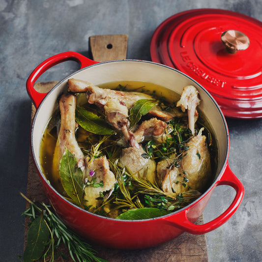 Signature Cast Iron 6.75-quart Cerise Round Wide Dutch Oven with Copper Knob