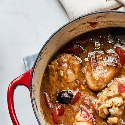 Signature Cast Iron 6.75-quart Cerise Round Wide Dutch Oven with Copper Knob