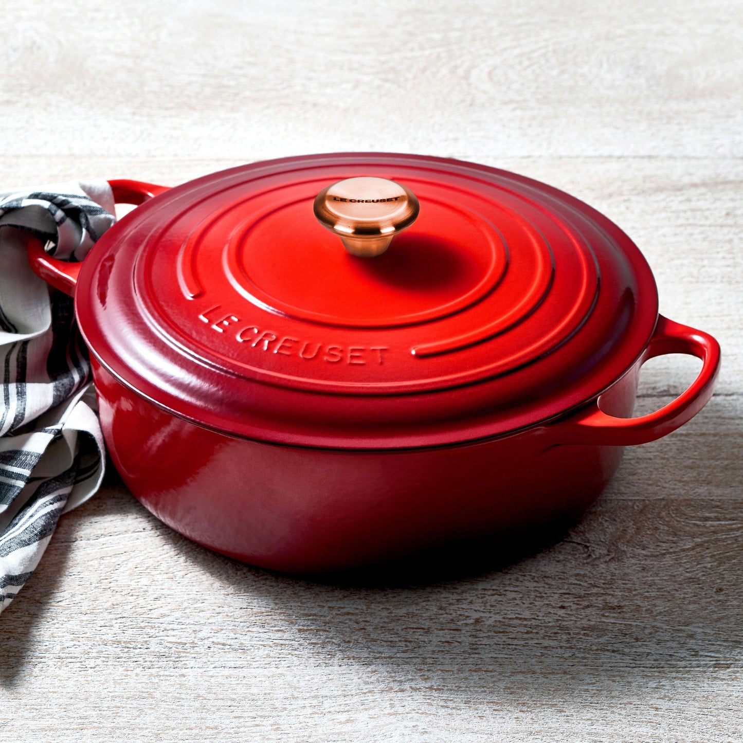 Signature Cast Iron 6.75-quart Cerise Round Wide Dutch Oven with Copper Knob